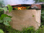 A large wooden cube with a fire inside