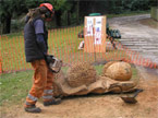 Work being undertaken on the underside detailling of the bench, with the acorns being roughed out