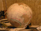 The ball covered in masking tape, with the saient poprtions of the tape removed ready for staining