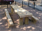 The second table with the photograph taken from a 45 degree angle, and an extra large starbucks cup resting on top of it - again