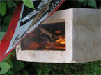 Photo of the cube with a fire burning inside it