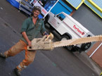 Photograph of the sculptor handling the finished product in a suggestive manner