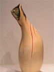 Finished red node vase, with a red infill where the natural cracks were, left side view