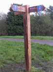 Photo seven in the Waymarkers section A closeup of a waymarker, showing a distance of 4 miles from Trethomas and 4 Miles from Bedwas