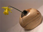 Yellow node vase with a Daffodil